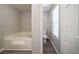 Relaxing bathroom showcasing a soaking tub and toilet with stylish neutral paint at 3534 S Portsmouth Cir, Lithonia, GA 30038