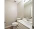 Neutral half bathroom featuring a modern vanity with a white countertop, a large mirror, and a toilet at 3534 S Portsmouth Cir, Lithonia, GA 30038