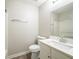 Neutral bathroom featuring a modern vanity with a white countertop, a large mirror, and a toilet at 3534 S Portsmouth Cir, Lithonia, GA 30038