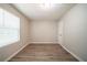 Bright bedroom featuring neutral paint and wood-look flooring, creating a serene and modern space at 3534 S Portsmouth Cir, Lithonia, GA 30038