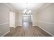 Elegant dining room featuring durable flooring, neutral walls, and contemporary lighting at 3534 S Portsmouth Cir, Lithonia, GA 30038
