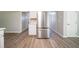 Well-equipped kitchen boasting stainless steel appliances, white cabinets, and modern floors at 3534 S Portsmouth Cir, Lithonia, GA 30038