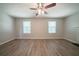 Bright living room offering durable flooring, neutral walls, ample windows, and a ceiling fan at 3534 S Portsmouth Cir, Lithonia, GA 30038
