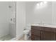 Modern bathroom featuring a glass-enclosed shower with white tile and a stylish vanity at 727 Crest Line W Trl, Powder Springs, GA 30127
