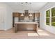 Well-equipped kitchen featuring quartz countertops, stainless steel appliances, and stylish cabinetry at 727 Crest Line W Trl, Powder Springs, GA 30127