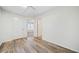 Neutral bedroom with wood flooring, two closets, and entryways to other rooms at 806 Longfellow Ct, Stone Mountain, GA 30088
