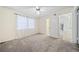 Bright bedroom with light walls, soft carpet, and bright windows at 806 Longfellow Ct, Stone Mountain, GA 30088