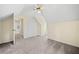 Inviting bedroom offering neutral walls, plush carpet, and a ceiling fan with door leading to the hallway at 806 Longfellow Ct, Stone Mountain, GA 30088