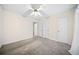 Bright bedroom with a ceiling fan, neutral carpet, and natural light at 806 Longfellow Ct, Stone Mountain, GA 30088