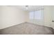 Inviting bedroom space featuring soft natural light and neutral carpet at 806 Longfellow Ct, Stone Mountain, GA 30088