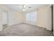 Bright and airy bedroom featuring a window with curtains and two closets at 806 Longfellow Ct, Stone Mountain, GA 30088