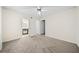 Spacious bedroom with neutral carpet and a ceiling fan at 806 Longfellow Ct, Stone Mountain, GA 30088