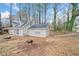 View of the home's exterior showcasing the overall architecture, landscaping, driveway, and natural surroundings at 806 Longfellow Ct, Stone Mountain, GA 30088