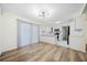 Open living area with hardwood floors, a kitchen, and natural light at 806 Longfellow Ct, Stone Mountain, GA 30088