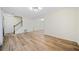 Open-concept living space featuring hardwood floors and a staircase at 806 Longfellow Ct, Stone Mountain, GA 30088