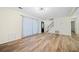 Inviting living room with hardwood floors, large windows, and modern lighting at 806 Longfellow Ct, Stone Mountain, GA 30088