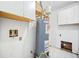 A view of the utility room, including the water heater, and washer/dryer hookups at 806 Longfellow Ct, Stone Mountain, GA 30088