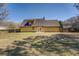 Backyard featuring a lawn and the back of the two-story residence at 105 Bentley Place Way, Covington, GA 30016