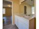 Bright bathroom featuring double vanity, a new mirror, and modern fixtures at 105 Bentley Place Way, Covington, GA 30016