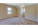 Spacious bedroom featuring natural light, neutral walls, and carpet floors at 105 Bentley Place Way, Covington, GA 30016