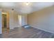 A spacious bedroom features new flooring and adjacent bathroom at 105 Bentley Place Way, Covington, GA 30016