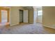 Bedroom featuring neutral walls and carpet, complemented by a closet at 105 Bentley Place Way, Covington, GA 30016