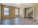 Bright and airy bedroom features two large windows and new gray flooring at 105 Bentley Place Way, Covington, GA 30016