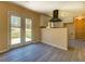 Dining area features modern floors and french doors to the backyard at 105 Bentley Place Way, Covington, GA 30016