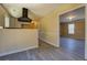 Bright kitchen with sleek gray floors and modern appliances at 105 Bentley Place Way, Covington, GA 30016