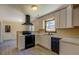 Well-lit kitchen features modern appliances, white cabinetry, and ample counter space at 105 Bentley Place Way, Covington, GA 30016