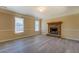 Inviting living room featuring modern floors and brick fireplace at 105 Bentley Place Way, Covington, GA 30016