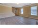 Spacious living room with modern floors and a large window at 105 Bentley Place Way, Covington, GA 30016