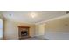 Cozy living room with a brick fireplace and neutral paint at 105 Bentley Place Way, Covington, GA 30016