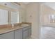 Bathroom featuring vanity and a mirror, with an open doorway to another room at 1116 Oak Hollow Ln, Hampton, GA 30228