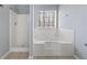 Bathroom with a separate shower and tub, providing convenient options at 1116 Oak Hollow Ln, Hampton, GA 30228