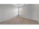 Carpeted bedroom featuring a window that allows natural light, providing a peaceful atmosphere at 1116 Oak Hollow Ln, Hampton, GA 30228