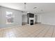 Spacious living room featuring tile floors and a fireplace, creating a warm and inviting atmosphere at 1116 Oak Hollow Ln, Hampton, GA 30228