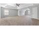 Large bedroom with a ceiling fan and two windows for natural light, offering comfort and relaxation at 1116 Oak Hollow Ln, Hampton, GA 30228