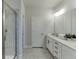 Bathroom featuring a double vanity, quartz countertops, and modern fixtures with tiled floors at 1238 Ainsworth Aly # 38, Sugar Hill, GA 30518