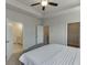 Bright bedroom boasts tray ceilings, fan and ensuite bathroom and walk-in closet at 1238 Ainsworth Aly # 38, Sugar Hill, GA 30518