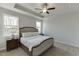 Bedroom features tray ceiling, neutral carpeting, and lots of natural light at 1238 Ainsworth Aly # 38, Sugar Hill, GA 30518