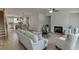 Open floor plan showcases living room with fireplace flowing into dining area and kitchen at 1238 Ainsworth Aly # 38, Sugar Hill, GA 30518