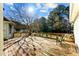 Wooden back deck with built-in benches provides an outdoor gathering and entertainment space at 1505 Ozora Rd, Loganville, GA 30052