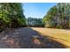 Spacious back yard surrounded by mature trees offering privacy at 1505 Ozora Rd, Loganville, GA 30052