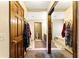Bathroom view featuring a soaking tub, toilet, and mirrored closet at 1505 Ozora Rd, Loganville, GA 30052