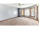 Spacious bedroom with multiple windows and carpet at 1505 Ozora Rd, Loganville, GA 30052