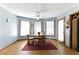 Charming dining room with natural light, wood floors, and view into the backyard at 1505 Ozora Rd, Loganville, GA 30052