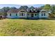Charming home featuring a well-manicured lawn and traditional architectural details at 1505 Ozora Rd, Loganville, GA 30052