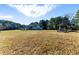 Expansive front yard and country home perfect for relaxation at 1505 Ozora Rd, Loganville, GA 30052