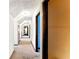 Spacious hallway with multiple doorways shows access to various rooms in the home at 1505 Ozora Rd, Loganville, GA 30052